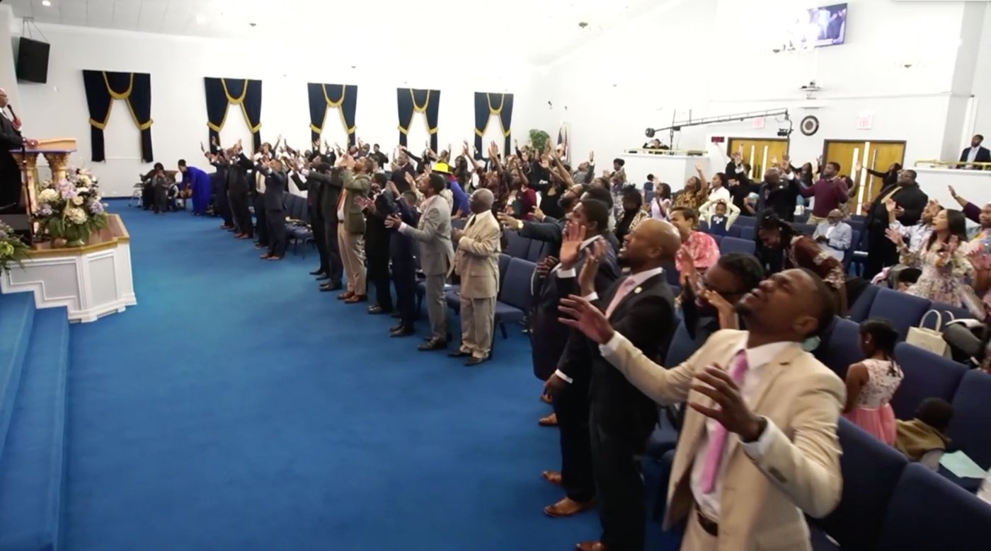 CFADD congregation at Promised Land CDC in worship